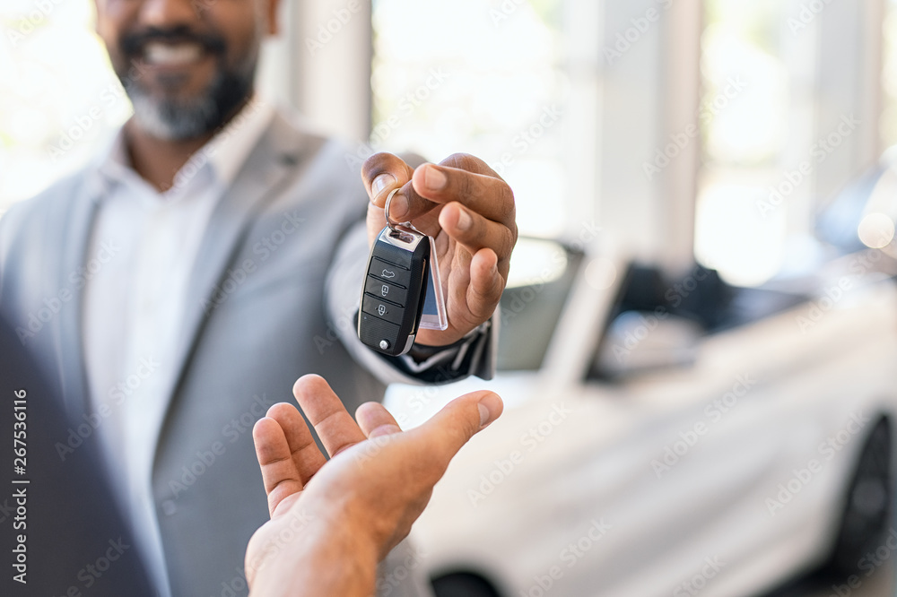 Man new car keys to customer arranged BMW Car Finance