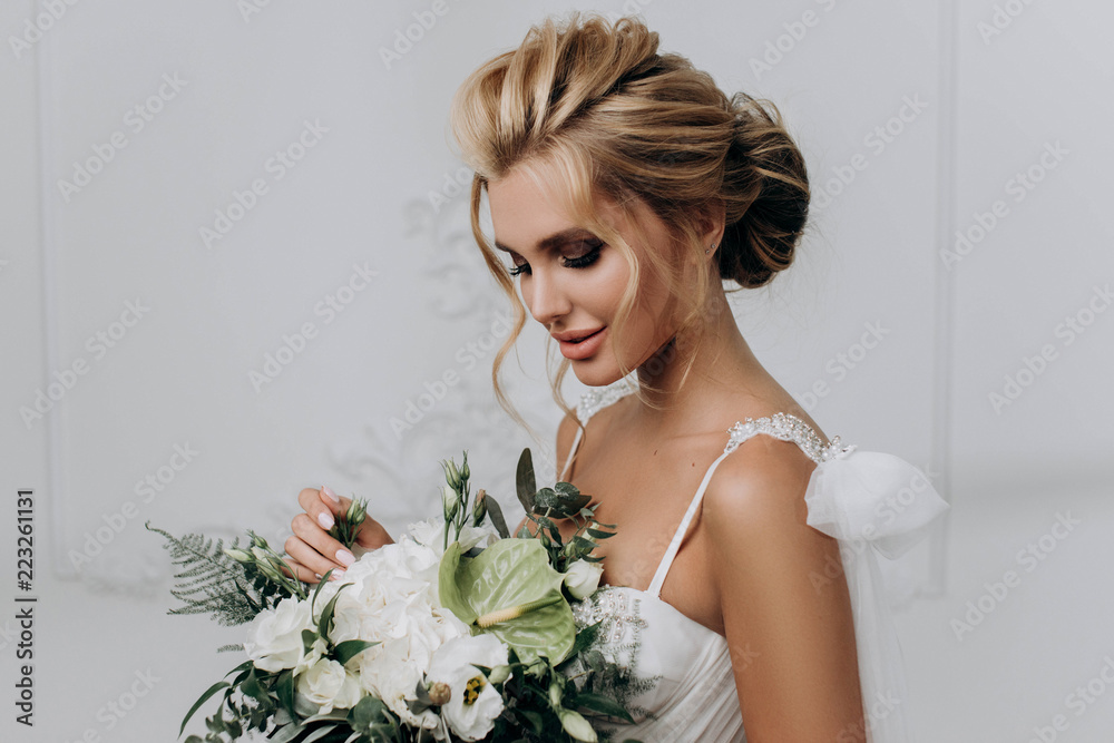 beautiful sexy young blond woman with soft glam wedding makeup