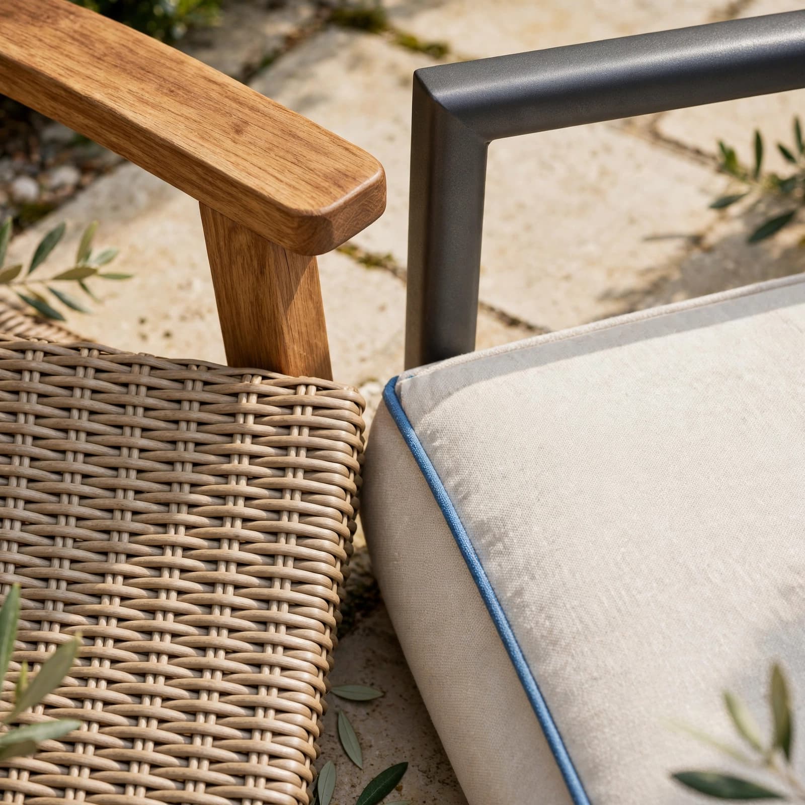 Patio furniture samples with timber, metal, woven rattan, and a blue-accented cushion.